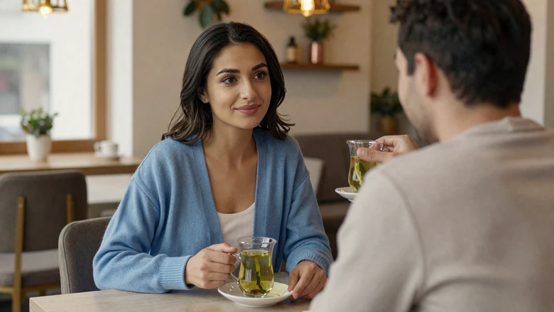 Uzbek woman and American man sharing tea at a cozy cafe building a genuine cross-cultural connection